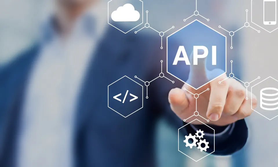 Person touching a digital diagram of connected API and cloud symbols