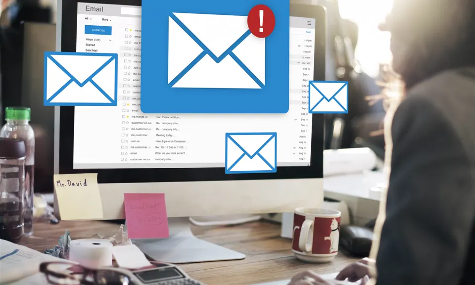 Email inbox on a desktop computer with envelope symbols