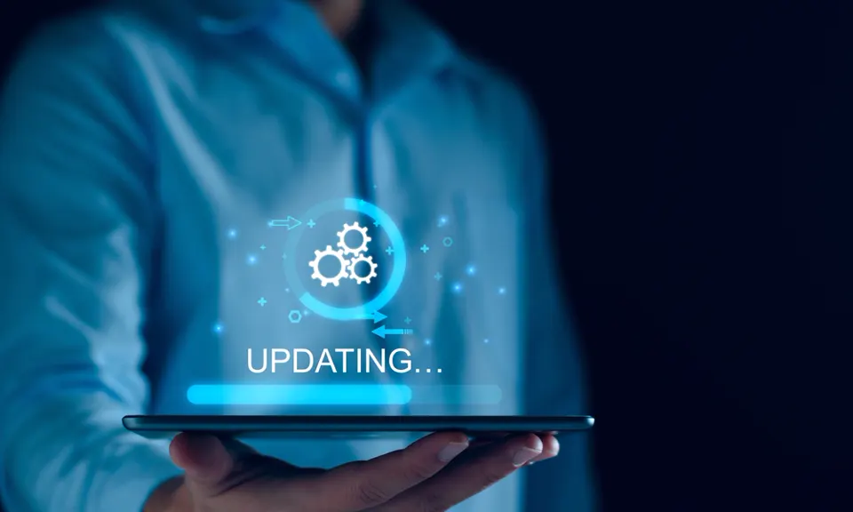 Tablet displaying an update progress bar and settings symbol